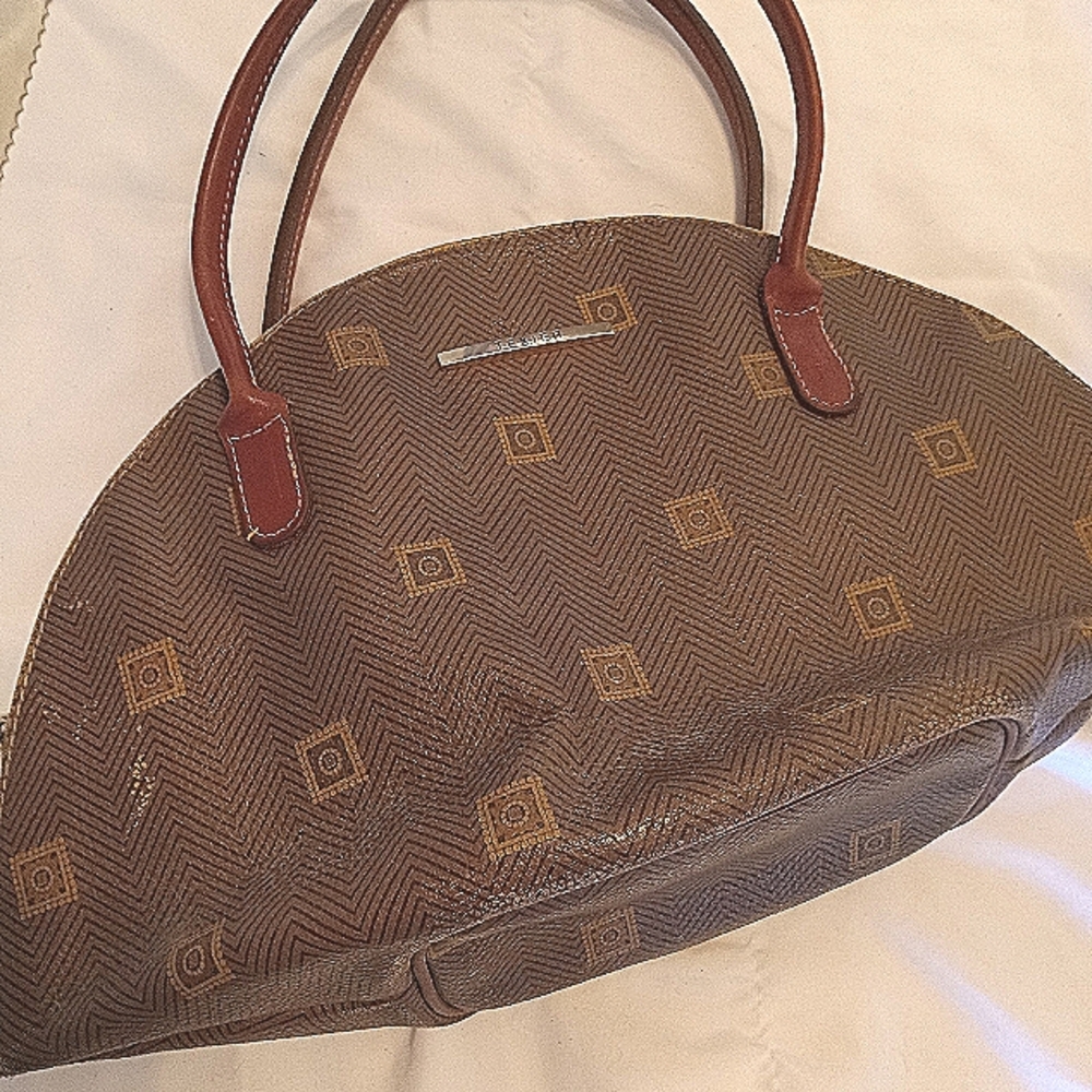Brown Duffel Bag with Crescent Shape and Textured Design